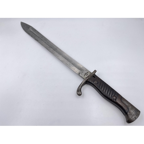 2312 - An original WWI German butcher's bayonet made by V.C. Schilling - approx. 50cm long including handle