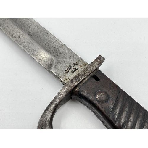 2312 - An original WWI German butcher's bayonet made by V.C. Schilling - approx. 50cm long including handle