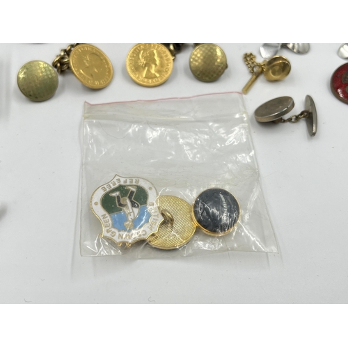 2331 - A collection of badges and cufflinks to include Wedgwood black Jasperware by Stratton Julius Caesar ... 