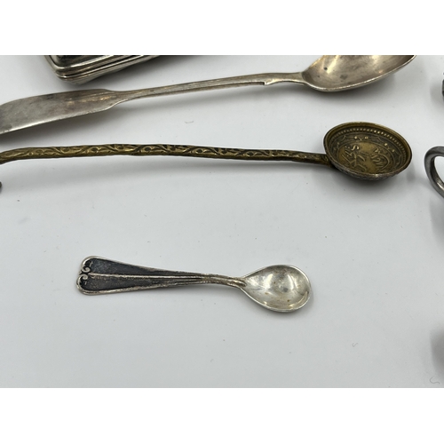 2332 - A collection of items to include .800 silver mustard spoon, Victorian hallmarked London silver condi... 