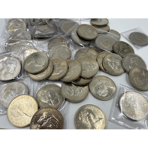 2341 - Fifty-eight commemorative twenty-five pence coins together with four Laos 5,000 and one 10,000 kip b... 