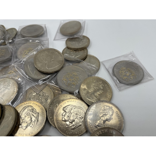 2341 - Fifty-eight commemorative twenty-five pence coins together with four Laos 5,000 and one 10,000 kip b... 