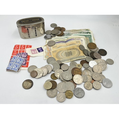 2342 - A collection of coins and banknotes to include fourteen 1970s £1 notes, one 1960s £1 note, 50% silve... 