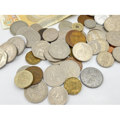 2342 - A collection of coins and banknotes to include fourteen 1970s £1 notes, one 1960s £1 note, 50% silve... 