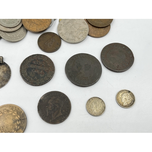 2343 - A collection of coins to include 83.5% silver 1963 Switzerland ½ franc, 64% silver 1935 and 1939 Net... 