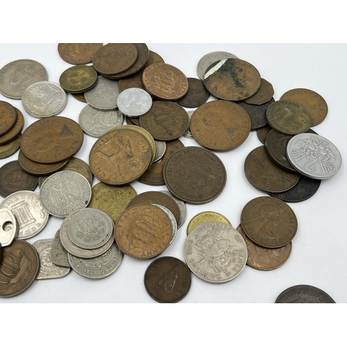 2343 - A collection of coins to include 83.5% silver 1963 Switzerland ½ franc, 64% silver 1935 and 1939 Net... 