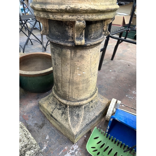 947 - Two garden items, one cast stone pedestal bird bath and one Victorian terracotta crown shaped chimne... 