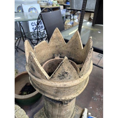 947 - Two garden items, one cast stone pedestal bird bath and one Victorian terracotta crown shaped chimne... 