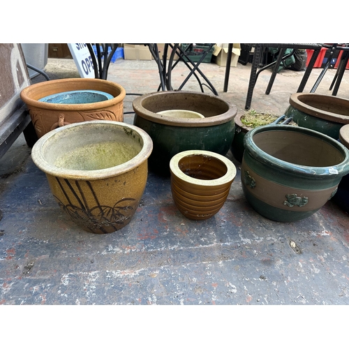 948 - Ten terracotta and glazed planters