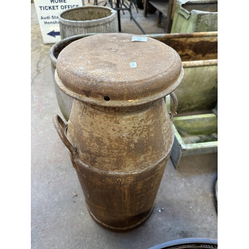 958 - A vintage CWS galvanised milk churn - approx. 74cm high