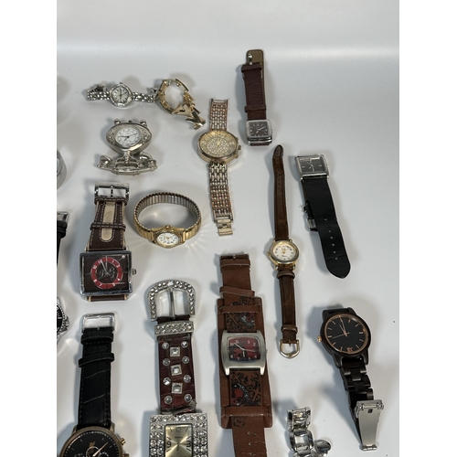 2181 - A large collection of quartz wristwatches to include Michael Kors, Geneva etc.