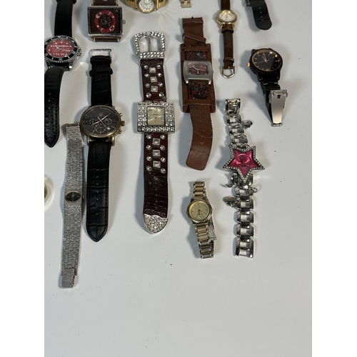 2181 - A large collection of quartz wristwatches to include Michael Kors, Geneva etc.