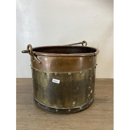 447 - A collection of antique metalware to include copper and brass riveted coal bucket, brass three piece... 