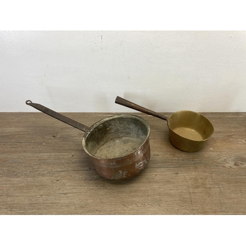 458 - A collection of antique and later brass and copper ware to include 19th century brass saucepan, six ... 