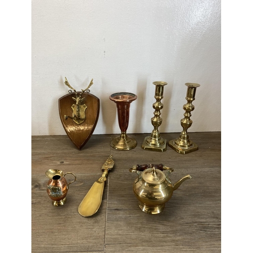 459 - A collection of copper and brassware to include novelty miniature companion set, brass jugs, miniatu... 