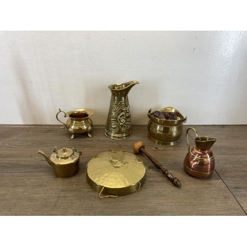 459 - A collection of copper and brassware to include novelty miniature companion set, brass jugs, miniatu... 