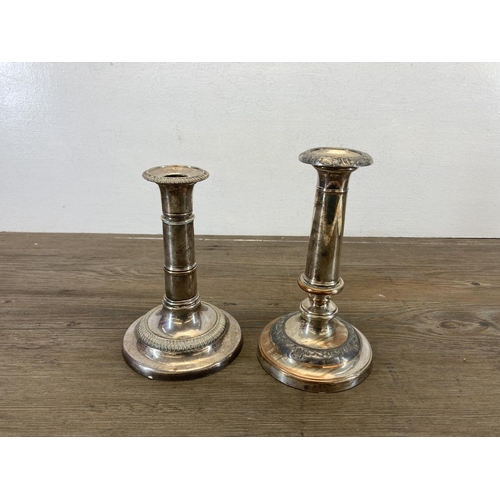 466 - Four 19th century style EPNS candlesticks, two three branch candelabras and two adjustable