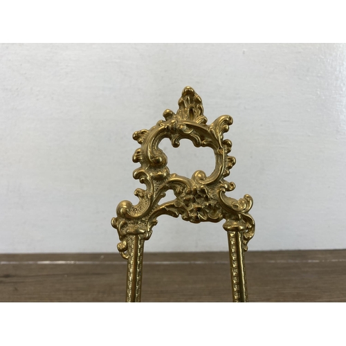 469 - A pair of Rococo style brass easels