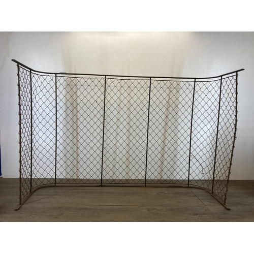 474 - A 19th century wrought metal and mesh fireguard - approx. 70cm high x 105.5cm long x 34cm deep