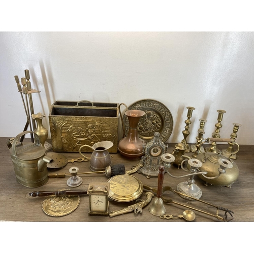 475 - A collection of metalware to include Garrard & Co brass and glass cased carriage clock, copper and b... 