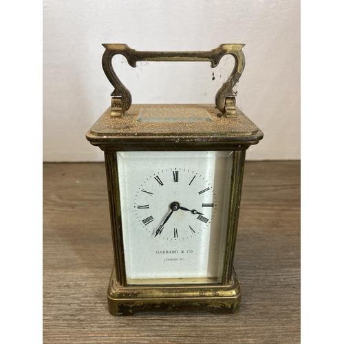 475 - A collection of metalware to include Garrard & Co brass and glass cased carriage clock, copper and b... 