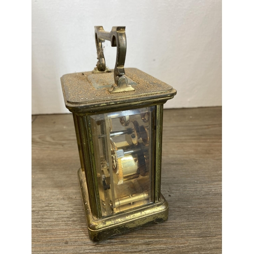 475 - A collection of metalware to include Garrard & Co brass and glass cased carriage clock, copper and b... 