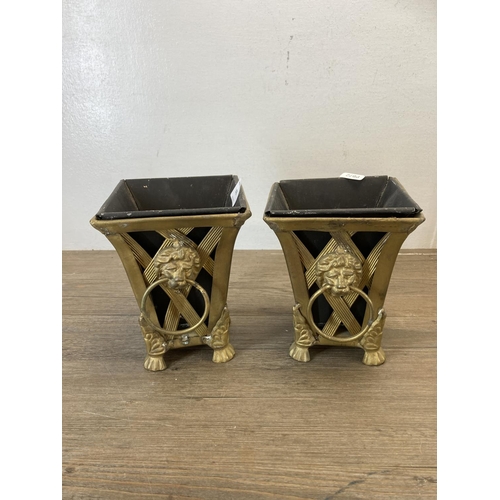 476 - Five items, one pair of gilt metal planters with lions head handles, one brass and glass candlestick... 