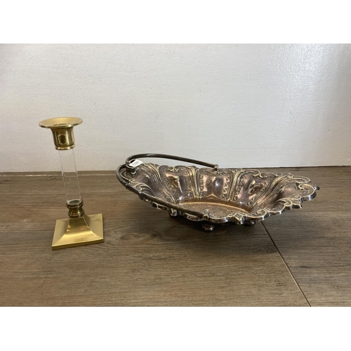 476 - Five items, one pair of gilt metal planters with lions head handles, one brass and glass candlestick... 