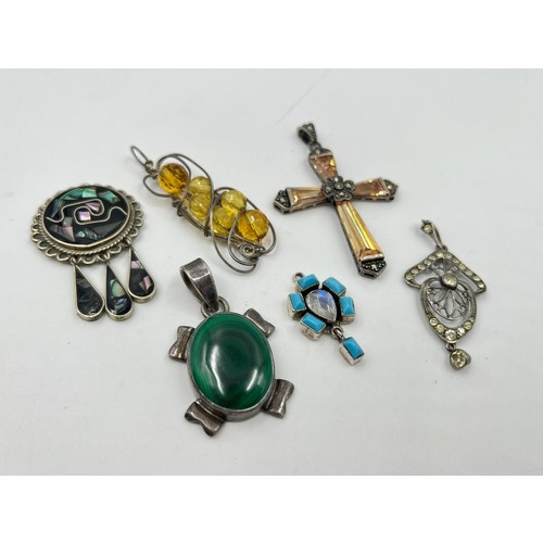 2101 - A collection of .925 silver gemstone set pendants to include malachite, abalone shell etc.