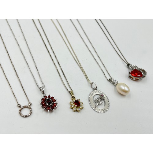 2104 - A collection of .925 silver necklaces to include garnet etc.