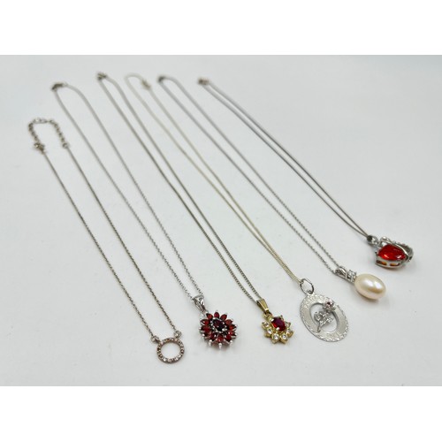 2104 - A collection of .925 silver necklaces to include garnet etc.