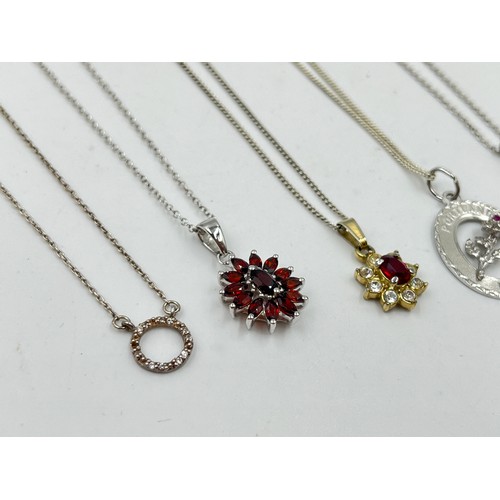 2104 - A collection of .925 silver necklaces to include garnet etc.