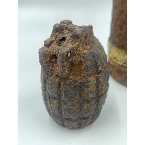 2310 - A WWI British relic Mills bomb and shell found on the Somme