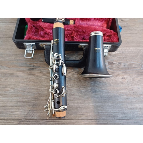 825 - A cased Yamaha YCL-34II B♭ clarinet with pull through and key oil