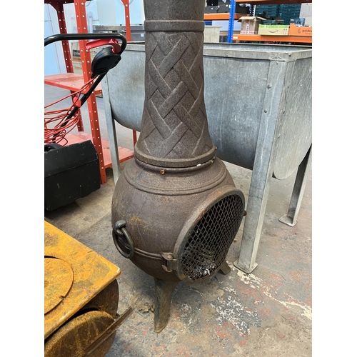 965 - A cast iron chiminea - approx. 110cm high