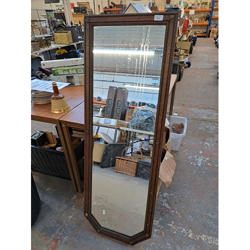 1001 - Two wall mirrors, one early 20th century oak framed and one Edwardian inlaid mahogany framed