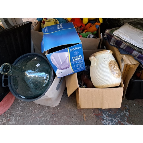 1010 - A large collection of house clearance items to include clothes, West German vase, glassware, ceramic... 