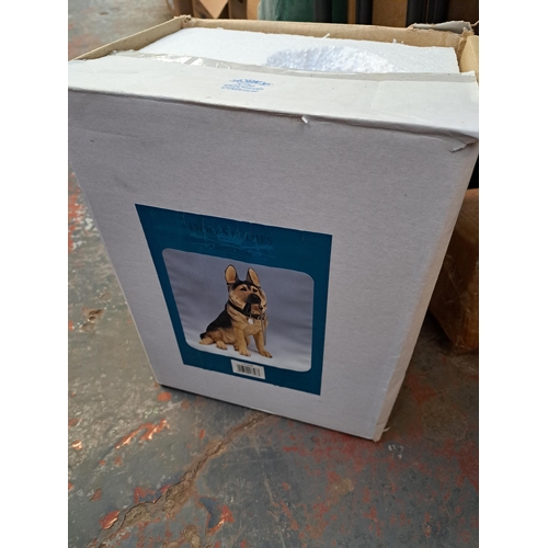 1018 - Three boxes containing boxed fibre optic Christmas tree, The Leonardo collection alsatian figurine, ... 