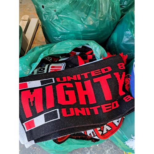 1026 - Nine bags containing a large collection of football scarves to include Manchester United, Manchester... 