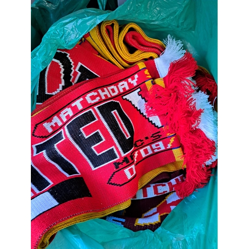 1027 - Nine bags containing a large collection of football scarves to include Manchester United, Manchester... 