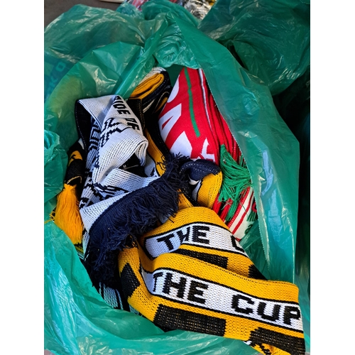 1027 - Nine bags containing a large collection of football scarves to include Manchester United, Manchester... 