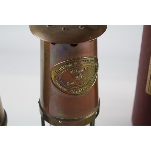 594 - Two brass miner's lamps to include boxed E. Thomas & Williams Ltd etc.