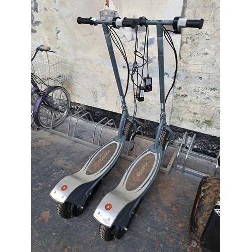 875 - Two Razor electric scooters with chargers