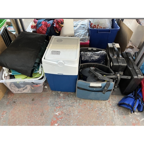 1038 - A large collection of house clearance items to include blow up mattresses, folding camping chairs, b... 