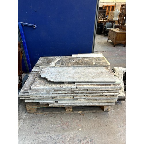 154 - A large quantity of marble and reconstituted stone slabs and off cuts