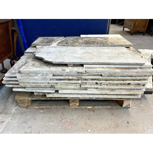 154 - A large quantity of marble and reconstituted stone slabs and off cuts