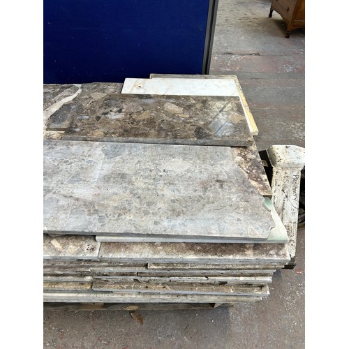 154 - A large quantity of marble and reconstituted stone slabs and off cuts