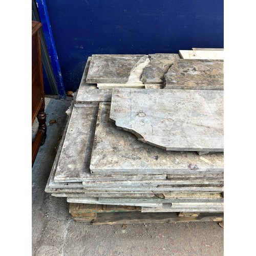 154 - A large quantity of marble and reconstituted stone slabs and off cuts