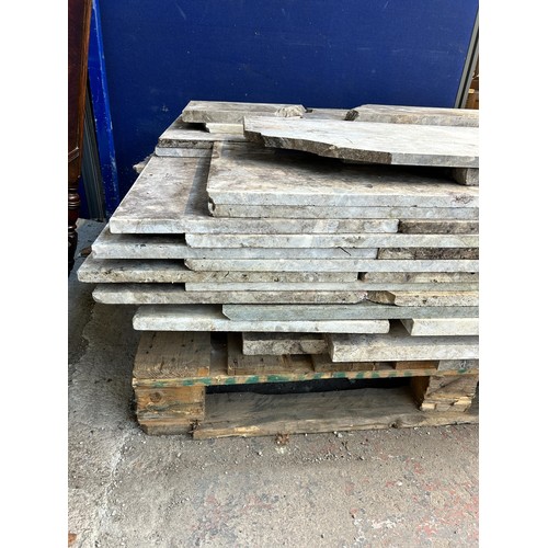 154 - A large quantity of marble and reconstituted stone slabs and off cuts