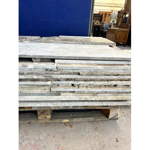 154 - A large quantity of marble and reconstituted stone slabs and off cuts